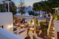 an aerial view of a restaurant with tables and chairs at 23 Hotel Mykonos in Mýkonos City
