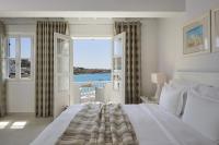 Postel nebo postele na pokoji v ubytování Petinos Beach Hotel