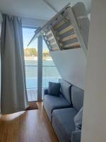 A seating area at Sundeck botel - party boat