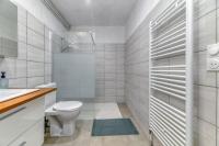 a white bathroom with a toilet and a shower at Le Charme Antique¶ Belle maison¶ Centre Gières in Gières