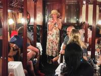 un grupo de personas sentadas en un tren en Out in Africa Wildlife Lodge, en Dinokeng Game Reserve