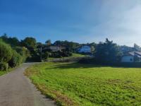 a road through a field with houses in the background at Vigny du lac in Publier