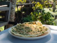 a piece of food on a plate on a table at Mekong Bird Resort & Hotel in Stœ̆ng Trêng
