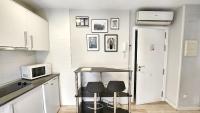 Kuchyň nebo kuchyňský kout v ubytování Cervantes Apartamentos
