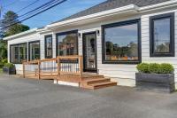 a house with a wooden ramp outside of it at Evangeline in Grand pré