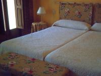 Postel nebo postele na pokoji v ubytování Hotel Balneario Almeida Dama Verde