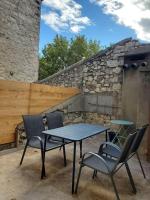 a table and chairs sitting on a patio at Le Bohème in Sigean