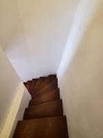 a spiral staircase in a building with wooden floors at Le Bohème in Sigean