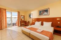 Posteľ alebo postele v izbe v ubytovaní Agrabella Hotel