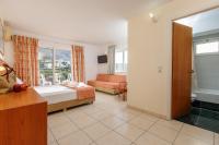 Posteľ alebo postele v izbe v ubytovaní Agrabella Hotel
