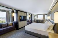 a hotel room with a large bed and a tv at Hilton Budapest in Budapest