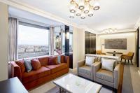 a living room with a couch and a table at Hilton Budapest in Budapest