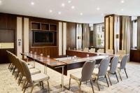 a conference room with a long table and chairs at Hilton Budapest in Budapest