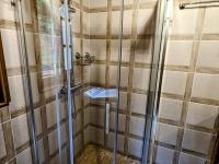 a bathroom with a shower and a sink at Gîte Anould, 4 pièces, 6 personnes - FR-1-589-2 in Anould