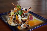 a plate of food with seafood on a table at Wattura Resort & Spa in Negombo