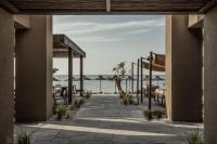 a view of the ocean from the patio of a resort at Casa Cook Samos - Adults only in Pythagoreio