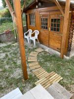 a wooden path leading to a cabin at Gîte ylangylang in Saint-Paul-le-Jeune