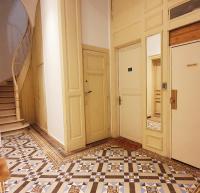 a hallway with a staircase and a tile floor at VIEUX LILLE Porte de Gand Bienvenue chez NESTYOU, Lille in Lille