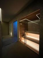 a room with a shower with a glass door at Hotel Franz in Gradisca dʼIsonzo