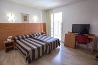 Postel nebo postele na pokoji v ubytování Cleopatra Spa Hotel