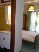 A bed or beds in a room at Hotel Prinos