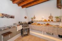 a kitchen with a bunch of food on display at Agroturismo Can Marquet - Adults Only in Santa Gertrudis de Fruitera