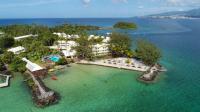 an aerial view of a resort in the water at Studio Fresh&amp;Cosy Trois-Ilets - 3 étoiles-Hotel Carayou in Les Trois-Îlets