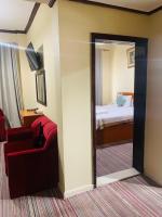 Postel nebo postele na pokoji v ubytování Al Jazeerah Hotel