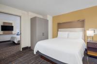 a hotel room with a large bed and a television at Holiday Inn Toronto Downtown Centre by IHG in Toronto