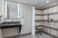 a bathroom with a sink and a shower at Holiday Inn Toronto Downtown Centre by IHG in Toronto