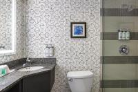 a bathroom with a toilet and a sink and a shower at Holiday Inn Toronto Downtown Centre by IHG in Toronto