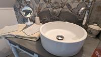 a bathroom with a white sink and a mirror at Au Bonheur de Cisse in Chouzy-sur-Cisse