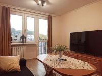 Televízia a/alebo spoločenská miestnosť v ubytovaní APARTAMENT CENTRUM Międzychód