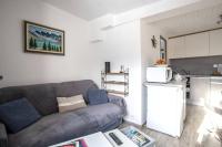 a living room with a couch and a kitchen at Appartement d&#39;une chambre avec vue sur la ville et wifi a Embrun in Embrun