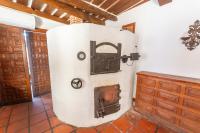a large white stove in a room at Hotel Rincón Castellano in Cuéllar