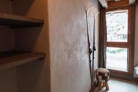 a door in a room with a window and a stool at Chalet Bio Corti 6p. 3 ch proche pistes&#47;commerces in Champagny-en-Vanoise