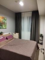 Postel nebo postele na pokoji v ubytování Unixx Pattaya