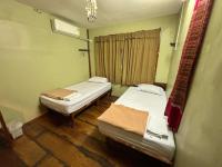 Postel nebo postele na pokoji v ubytování DonMueang Boutique House DonMueang Airport
