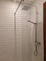 a bathroom with a shower with a glass door at Loft en duplex 270 m2 &amp; Jardin patio terrasse sauna in Chaville
