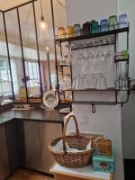 a kitchen with a basket on a shelf at Loft en duplex 270 m2 &amp; Jardin patio terrasse sauna in Chaville