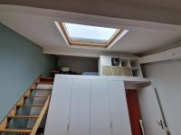 a loft conversion of a house with a skylight at Loft en duplex 270 m2 &amp; Jardin patio terrasse sauna in Chaville