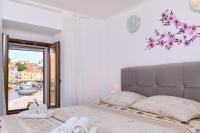 Posteľ alebo postele v izbe v ubytovaní Apartments Antonella