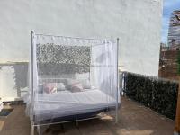 A bed or beds in a room at Alzira bonita Ático E Plaza Mayor con gran terraza