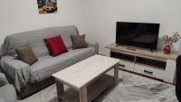 Televízia a/alebo spoločenská miestnosť v ubytovaní Apartamentos Séneca junto al Centro