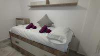 Posteľ alebo postele v izbe v ubytovaní Apartamentos Séneca junto al Centro