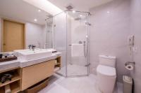 a bathroom with a shower and a toilet and a sink at Sonnien Hotel in Taipei