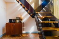 a staircase in a room with a wooden cabinet at Hotel Mercier in Amsterdam