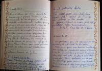 a page of an open book with handwritten handwriting at Appartement d&#39;une chambre avec vue sur la ville et wifi a Embrun in Embrun