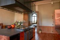 a kitchen with a stove and a counter top at DOMAINE LE MEZO in Ploeren