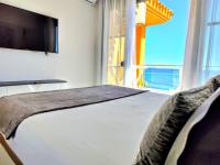 A bed or beds in a room at Getares Beach